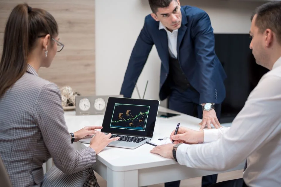A top view of marketing strategy documents and graphs arranged on a desk, showcasing business planning.